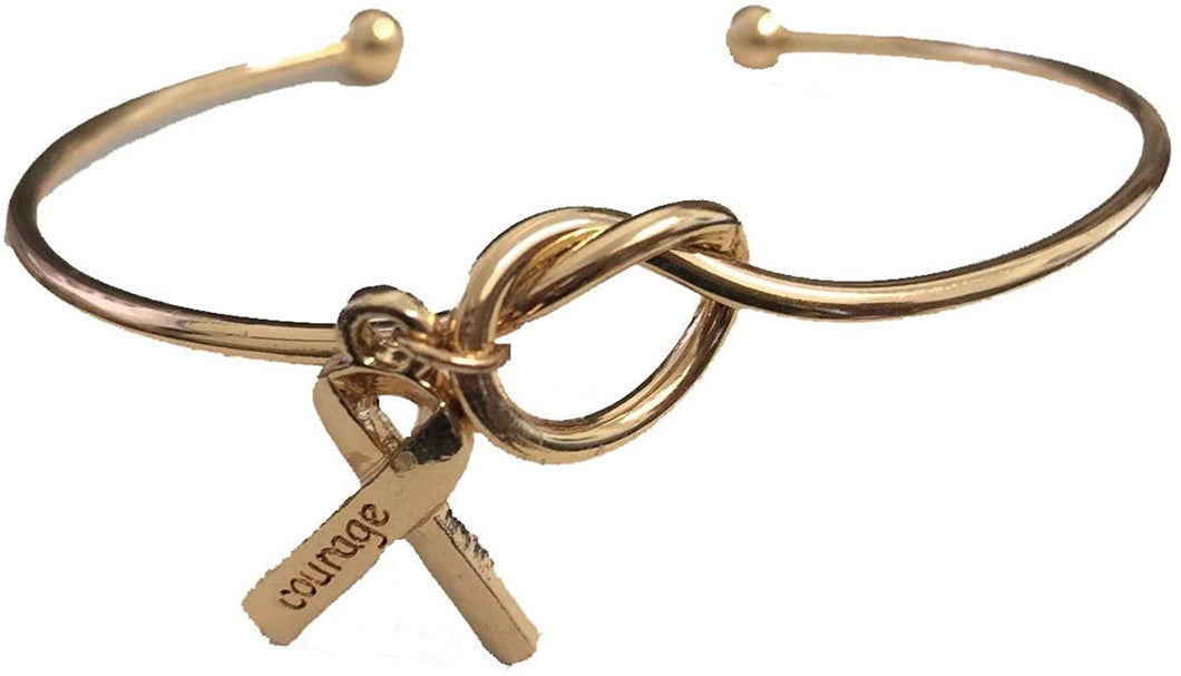 Bracelet Octobre Rose. Bracelet jonc Noeud avec Un Ruban doré et l'inscription Courage. BRACELET Cancer