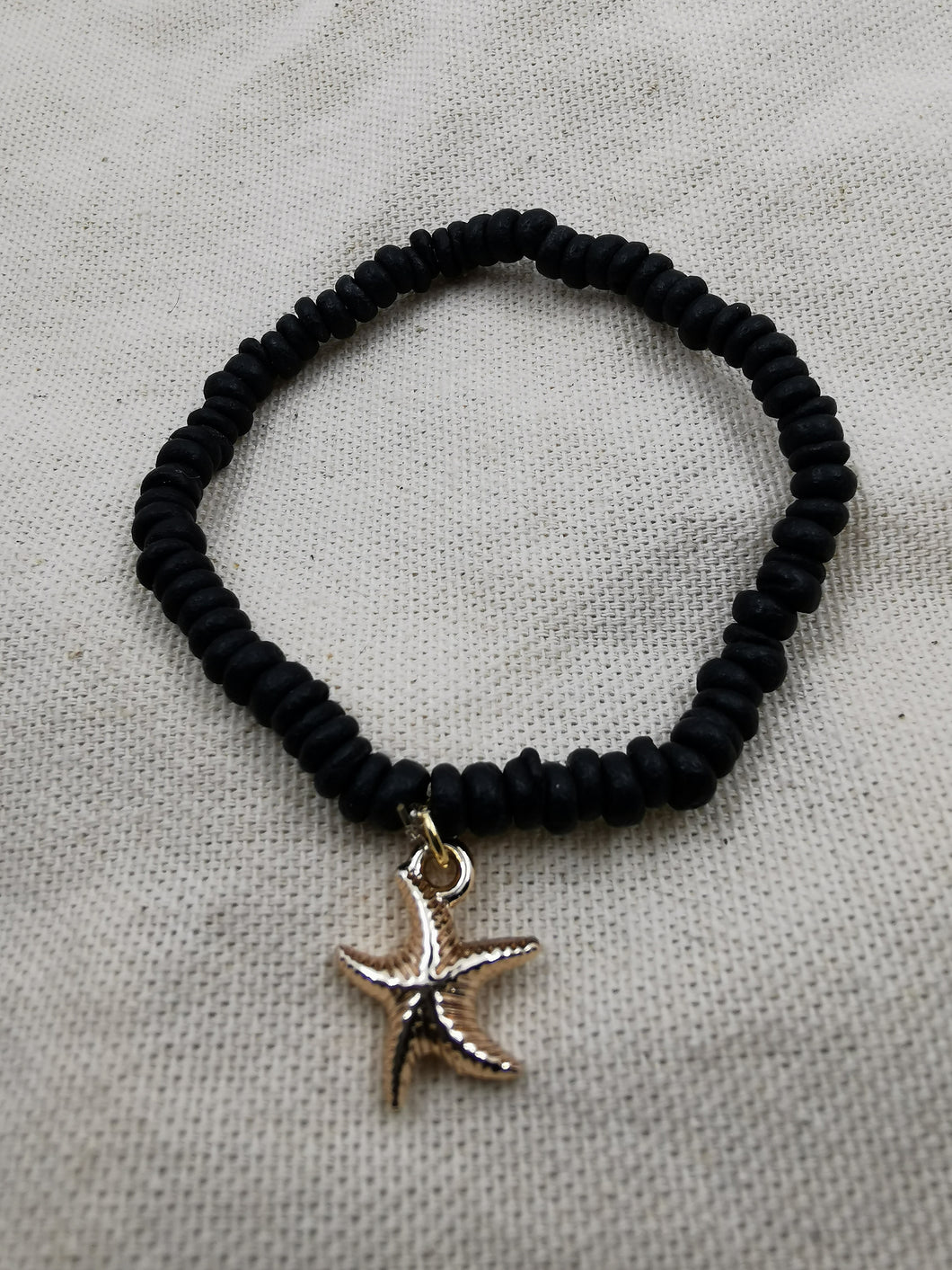 Bracelet NIAGARA avec perle en bois et pendentif étoile de mer doré